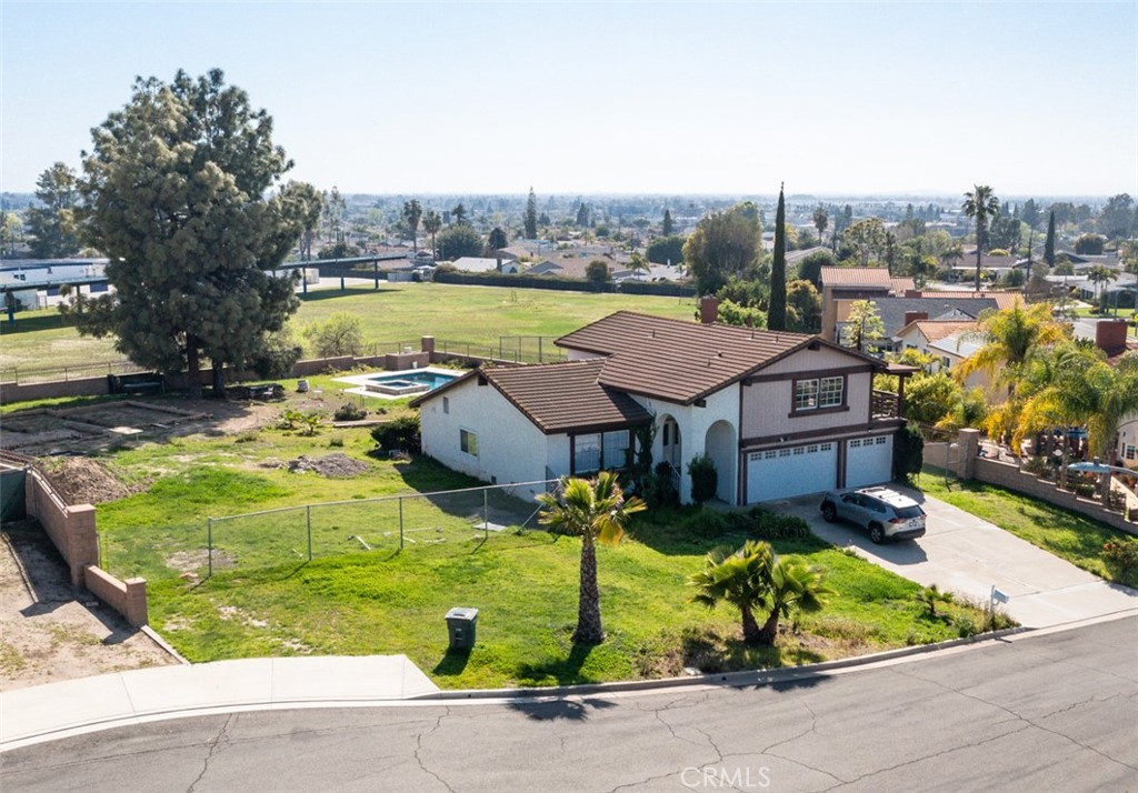 Prime Location with Endless Possibilities! Nestled in a cul-de-sac, just one block from Los Coyotes Country Club, this tri-level home sits on an expansive 21,171 sf flat lot, offering incredible potential for customization and investment. The existing home features 2,365 sf, 3 bedrooms, 3 baths and spacious 3-car garage. The luxurious, oversized pool adds a resort-like feel, while the south-facing backyard brings in abundant natural light. With plenty of space, you have the option to build two ADUs-one is already fully permitted, and the second can be approved if desired. Imagine designing a stylish, one-story ADU to perfectly complement the property! Plus, the lot is in the process of being split into two parcels, creating even more investment opportunities. A rare find in a prestigious location-don't miss this chance to maximize value and bring your vision to life!