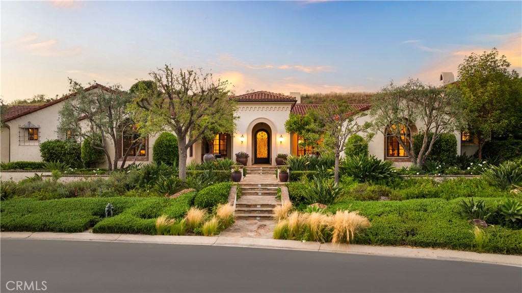 Discover luxury living in this stunning Tuscan-inspired custom-built estate, nestled in the prestigious Shady Canyon guard-gated community. Surrounded by approximately 16,000 acres of preserved rolling hills, this impressive residence spans nearly 8,000 square feet of living space on an ultra-private 23,305 square feet lot.