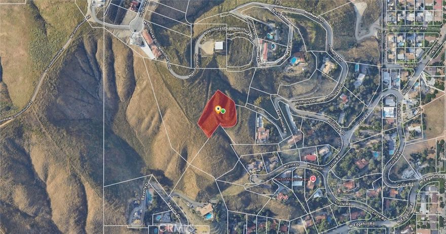Build-able hillside estate lot with views of the Inland Empire. See aerial maps.