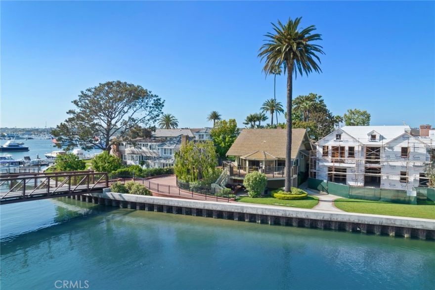 A classic traditional Balboa bay front cottage located on delightful Bay Island in the heart of Newport Harbor. Brimming with the nostalgia of simpler times and a history dating back to 1903 when the Bay Island Club originated as a "Gun Club" for wealthy Southern Californians, this romantic and refined enclave of twenty-three residences is accessed by a private bridge off of the Balboa Peninsula. Here homeowners enjoy exclusive common ownership of resplendent flowering gardens and grassy lawns, tennis, a garage parking structure, caretaker's cottage, and a wide sandy beach.  Positioned on a large corner lot, 22 Bay Island has a rich past as one of the earliest homes on the Peninsula.  Its original owner, William Burnham, was one of the Island's first five shareholders in 1903, and was instrumental in the development of Balboa Peninsula.  With its vintage characteristics still intact the Craftsman-style home enjoys spectacular views of Newport Harbor and glistening city lights from every vantage point. An enviable address, Bay Island is just a short stroll to restaurants, shops, the Peninsula's best beaches, the boardwalk and the the world famous Fun Zone. Bring your imagination to this piece of paradise and remodel or redevelop, as this 4,400 square foot lot will accommodate a new home of up to 5,700 square feet.  A private pier and dock to hold a vessel of 55 feet and side-tie complement this historic offering.