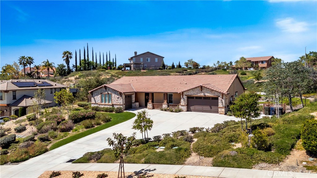 Welcome to 1631 Calle Solejar Drive, a 2018 custom built single-story luxury estate in the prestigious hills of Redlands, CA. Nestled on over an acre in the exclusive enclave of Cielo Ridge II, this brand-new, single-level estate redefines refined living. Showcasing exquisite craftsmanship and elevated design, this remarkable 3,600+ sq. ft. residence offers 5 spacious bedrooms and 3 full bathrooms, with the stunning private casita/junior suite having its own separate entrance – perfect for overnight guests or multigenerational living. Step through the grand entryway into an expansive great room adorned with a warm, inviting fireplace. The heart of the home is a designer gourmet kitchen featuring an oversized center island with dual-sided cabinetry—perfect for both everyday living and lavish entertaining. Enjoy a formal dining room ideal for elegant gatherings, as well as a versatile home office, and a dedicated tech room. The kitchen boasts premium stainless steel appliances, including a built-in oven, microwave, and a professional-grade 6-burner gas cooktop. Retreat to the lavish primary suite, complete with a spa-inspired walk-in shower and an expansive walk-in closet designed to impress. Unwind or entertain in the covered outdoor living space, enhanced by four-panel glass doors, integrated lighting, and prewiring for a ceiling fan and TV—creating a seamless indoor-outdoor experience. Additional upscale features include a well-appointed laundry room, recessed lighting throughout, raised panel interior doors, elegantly rounded wall corners, oversized base molding, a state-of-the-art tankless water heater, water filtration system, wireless alarm system, and solar.