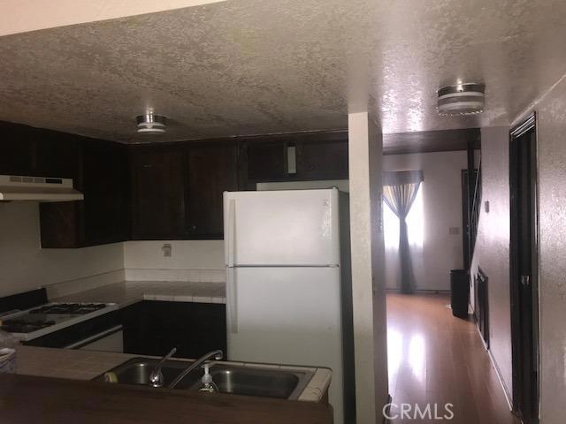 This is a spacious 2 bedroom, 1.5 bath apartment (part of a quadruplex.) It includes a dishwasher, stove, fireplace, refrigerator, upstairs closet for washer and dryer hookups(stacked would be best option), and large closets. This home has a beautiful view off the back patio and balcony. Close to ski resort, shopping, schools, and local entertainment. Must make appointment for viewing. Association Amenities: None Landscaping: Natural Special Features: None