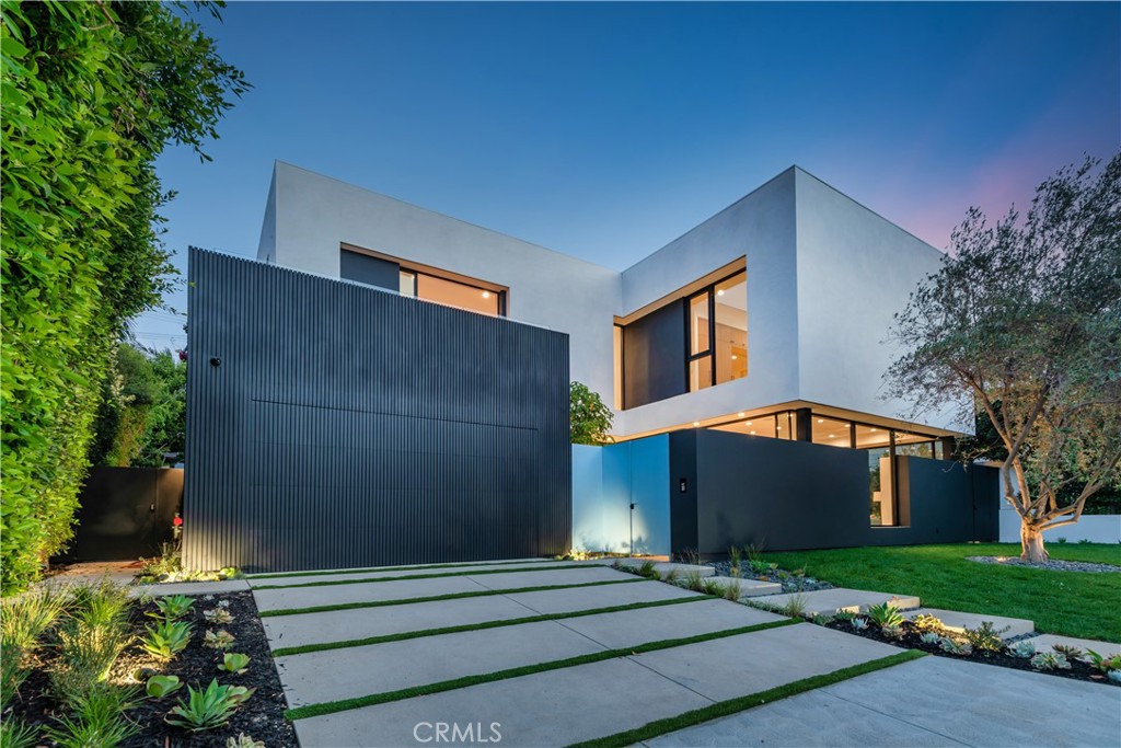 Absolutely exquisite upscale modern in prime Brentwood! Exceptional brand new masterpiece designed by acclaimed Crockett Architects. Sensational setting with complete privacy on a quiet cul-de-sac. Designed and built with the finest finishes, this 5 bedroom 5.5 bath open concept floor plan boasts every amenity expected by the most sophisticated buyer. Features include a privately gated entrance, dramatic two story entry with floating custom staircase, several massive pocket doors, wide plank white oak wood floors throughout, detailed custom woodwork, soaring custom ceilings and so much more. The low maintenance rear grounds provide a beautiful pool with water feature, outdoor kitchen, fireplace, an additional separate outdoor half bathroom/changing room all surrounded by mature trees and landscape. Other amenities include control 4 smart home system, security cameras and alarm inside and out, surround sound throughout and much more. A truly exciting new construction architectural estate in the heart of Brentwood!