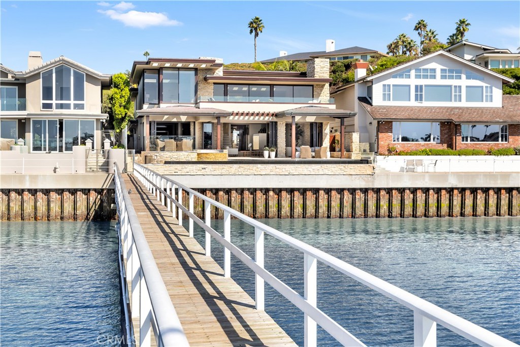 Devoted to a lifestyle abundant in features, encompassing approx. 54 feet of prime bay frontage.