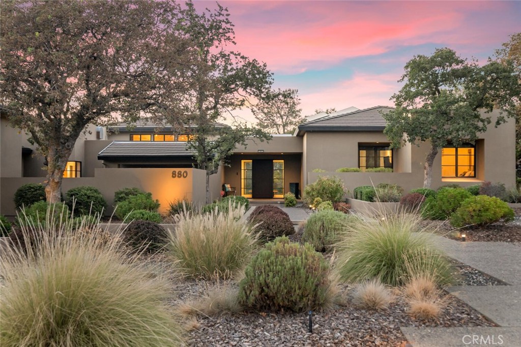 GORGEOUS VIEWS, INFINITY POOL AND OWNED SOLAR!! This 3-bedroom, 3.5-bathroom home is a masterpiece, nestled against Bidwell Park with panoramic views of Upper Bidwell Park, Bidwell Golf Course, and the coastal mountains. Situated on 1.39 acres, this 4,174 SQFT residence offers an array of premium features and breathtaking natural scenery. As you approach, you'll be greeted by beautiful, mature landscaping designed to seamlessly blend with the Bidwell Park environment. The home boasts an infinity saltwater pool & waterfall, an in-ground saltwater jacuzzi, owned solar panels, along with an oversized 3-car garage and a game room for endless entertainment. Inside, large windows flood the living spaces with natural light, while a huge slider in the living room gives access to the back patio, perfect for enjoying the stunning views. The living room features high ceilings and a beautiful ledger stone gas fireplace. Adjacent to the living room is an extra-large office, complete with built-in cabinets, bookshelves, and ample storage. The kitchen itself is a chef's dream, featuring soapstone countertops, a large stainless steel sink, stainless steel appliances, a gas range, a Subzero refrigerator, and ample cabinet space. The primary suite is a true retreat, boasting a HUGE walk-in closet with built-ins and a gas fireplace. The primary bathroom is elegantly appointed with a dual-sink vanity and modern wall-mounted faucets, a SPACIOUS shower with park views, and a large jacuzzi tub surrounded by beautiful large-format marble floors and walls. There are two generously sized guest bedrooms and a guest bath with a large walk-in shower. The game room is an entertainer's paradise, featuring a 160” 4K projection TV with 9 speakers, electric fireplace, pool table, dartboard, and a full bath with a steam shower. Additional amenities include a temperature-controlled, 480+ bottle wine cellar and built-in speakers throughout the home and patio. The backyard boasts a main patio with spectacular canyon views, providing a serene backdrop while enjoying the luxurious infinity saltwater pool. A second patio, ideal for entertaining, includes a built-in BBQ with a sleek concrete counter and a bar refrigerator, making it the ultimate spot for hosting gatherings. Finally, the oversized 3-car garage is equipped with a rapid EV charging station and plenty of storage, making this home not only beautiful but also practical and eco-friendly.