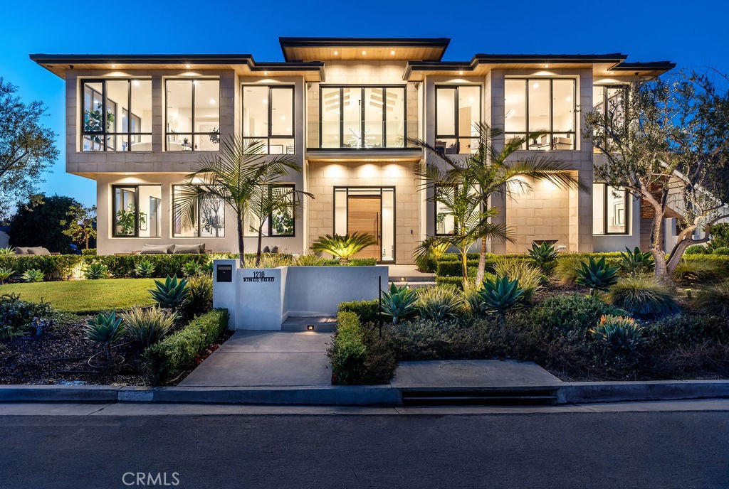 Welcome to 1210 Kings Rd., a stunning bluff-top estate located in the prestigious city of Newport Beach, California. Situated on an expansive lot with breathtaking views of Catalina Island, the Pacific Ocean and Newport Harbor, this luxurious property offers the ultimate coastal living experience. This exquisite home features a timeless architectural design that seamlessly blends modern elegance with coastal charm. The grand entrance welcomes you with a soaring ceiling and an abundance of natural light, creating a warm and inviting atmosphere throughout. The spacious open floor plan encompasses approximately 7,000 square feet of living space, providing ample room for both entertaining and comfortable everyday living. The main level boasts a gourmet kitchen equipped with dual top-of-the-line appliances, a center island, and a wine wall. The adjacent formal dining room is perfect for hosting intimate dinners or large gatherings. The upper level living room showcases floor-to-ceiling windows that frame the picturesque views. A separate family room offers additional space for relaxation and entertainment, complete with a full bar. Retreat to the tranquil master suite overlooking the water, a luxurious en-suite bathroom with a soaking tub, dual vanities, and a walk-in closet. Four additional en-suite bedrooms provide ample accommodations for family and guests. Step outside to the expansive outdoor living area, where you'll find a sparkling pool, spa, and a spacious patio perfect for al fresco dining and entertaining. A roof top deck with fireplace adds additional views and private space to entertain or just unwind. Located on the highly coveted Kings Road, just minutes away from world-class shopping, dining, and entertainment options, as well as pristine beaches, this home offers the epitome of coastal California living. Don't miss the opportunity to own this exceptional estate in the heart of Newport Beach.