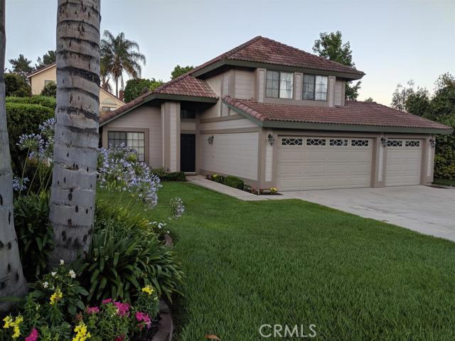 This beautiful home is perfect for relaxing with the family or entertaining friends. Welcoming entrance features a formal living room with vaulted ceilings, fireplace and travertine stone with granite inlay flooring that flows throughout the kitchen, dining room and guest half bath. Main level family room and bedroom (with private bath) have new plush carpet. Spacious open kitchen has all custom cabinets with ample storage, built in fridge, double oven, indoor BBQ grill, island, and huge granite countertops. Second level offers a large master bedroom with walk-in closet, master bath and private deck, two more bedrooms and full bath. New carpeting throughout. Professionally landscaped front and back yards. The back yard features a large patio cover, fountain feature and abundant beautiful foliage and large storage shed. Spacious 3 car garage with built-in cabinets and attic storage with pull down ladder access. You will love calling this home. The home's exterior was painted in late 2018. No Mello Roos or HOA.