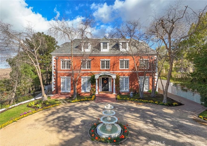 Step into the enchanting world of Ivy's Gate, a breathtaking Queen Anne style huge estate, thoroughly updated in 2016. This magnificent residence, a true masterpiece of early 20th-century English architecture, evokes the elegance of the renowned "Salutation" estate in Kent, England. Spanning 8,700 square feet of luxurious living space, Ivy's Gate boasts an impressive six bedrooms and eight baths, set amidst a sprawling one-acre estate offering spectacular hillside views. This estate also includes a large functioning vineyard and facilities for processing wine, an ideal space for wine enthusiasts and connoisseurs.  Additionally, the lower grounds provide ample room for a horse paddock backing horse trail if desired, offering endless possibilities for equestrian pursuits or simply enjoying the serene, expansive outdoor setting. 
The heart of this exceptional home lies in its opulent chef's kitchen, equipped with top-tier built-in appliances including a new Sub Zero, La Cornue 6 gas burner stove, 2 electric convection ovens and Kirkstone slate countertops, creating a seamless blend of style and functionality. The interior design showcases uncompromising craftsmanship, with soaring ceilings, exquisite moldings, marble entryways, and herringbone hardwood flooring that add to the residence's sophisticated ambiance. The estate boasts a versatile layout, featuring a movie theater, elegant formal dining and living areas, spacious family room, and office, making it an ideal haven for both intimate family life and grand-scale entertaining. The third level can be configured as a game room or maid's quarters, offering flexibility and adaptability.
The lush grounds at Ivy's Gate are a true haven, boasting a covered patio with outdoor barbecue and bar, shimmering pool and spa, verdant vegetable garden, serene vineyard, peaceful koi pond, and a playground. For the discerning car enthusiast, the property's crowning jewel is its expansive, 3,500-square-foot underground eight-car garage. Whether you’re hosting grand events, savoring the views, or unwinding in your private sanctuary, Ivy's Gate stands as a true masterpiece in every sense of the word—an unparalleled estate where history, beauty, and modern luxury converge.