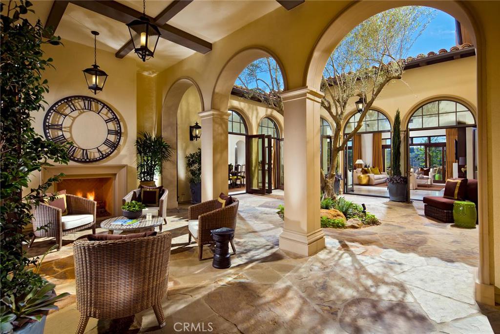 Brand New Model Home opportunity! Located at Fiano in the final enclave of luxury residences in Pacific Ridge, Newport Coast. Formal Italian architecture with groundbreaking connections of interior and exterior living spaces. Views of the Ocean and Catalina Island. Dramatic 14 foot ceilings throughout first level enhanced by the custom stained beams. Sliding glass doors to the loggia, and french doors to the courtyard allow you to expand your living area and bring the exterior living spaces into your celebration. Interiors that are modern, fresh, and relevant to your lifestyle include a large island with Quartzsite Taj Mahal slab countertops, Full limestone honed staggered backsplash, surrounded by upgraded stainless steel Wolf, SubZero Bosch. Butler's Pantry includes two 18" and one 30" wine steward. This home features Two 1000+ sq ft master bedrooms, downstairs master has fully custom luxury closet from floor to 14' ceiling. a dining room with two french doors to the courtyard, Staggered honed Limestone floors, Fabrica wool carpets, large master bedrooms, Lounge/Theatre area, Exterior features courtyard, Large custom Spa, & Garden area. Purchase will close in December and home will be leased back until April 30, 2016.
