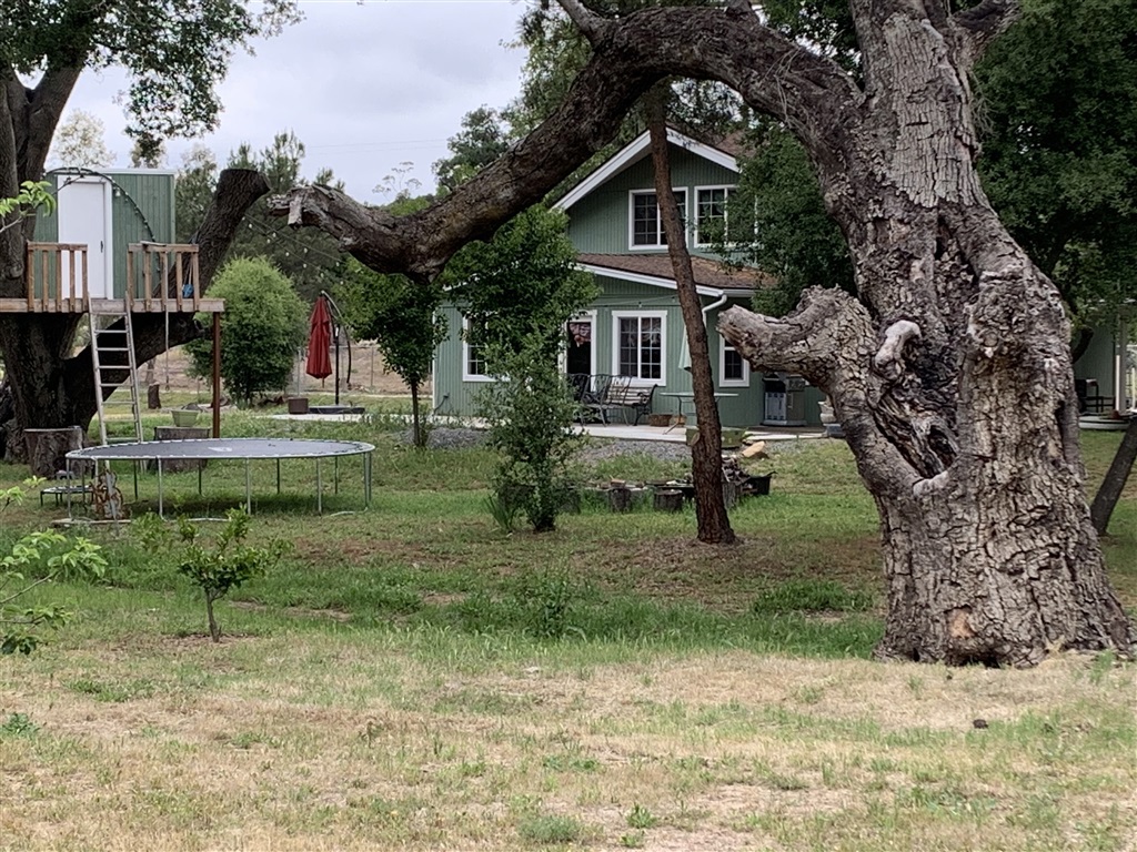 This chalet style house is nestled amongst over a hundred trees on a park-like setting. 2.64 acres of 100% usable land. This home offers three master-size bedrooms, two upstairs with walk in closets. It includes two bathrooms, one with a spectacular claw bathtub under a 4x4 ft. skylight-what a view! This open floor plan offers a remodeled kitchen with newer stainless-steal appliances. The dining area, kitchen and family room flow through a sliding glass door to an outside patio for entertaining. No matter where you look, you're bound to fall in love with this idyllic setting. Buyer and Buyer's agent to verified all information's, including room measurements, zoning, restrictions, permits, fencing,..etc. before close of Escrow.. Neighborhoods: Jamul Equipment: Garage Door Opener Other Fees: 0 Sewer: Septic Installed Topography: LL