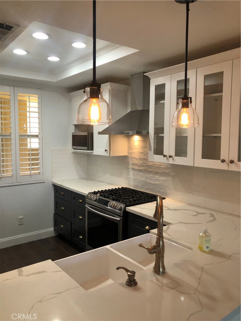 Highly upgraded, beautiful 2 bedroom, 2 bathroom condo with incredible natural light throughout. Kitchen needs to be seen to be believed...farmhouse sink, amazing countertops, gorgeous cabinetry with ample storage and high end appliances that may make you want to stay home and cook every night! New floors throughout, and just wait until you see the beautifully renovated bathrooms. Spacious bedrooms with great closets, and a wonderful laundry area, complete with washer and dryer for your use! The balcony has beautiful views and access from both the living room, as well as the main bedroom, and is ready and waiting for you to enjoy a relaxing evening. Great space for a dining table in the main area...So much more to see as well!