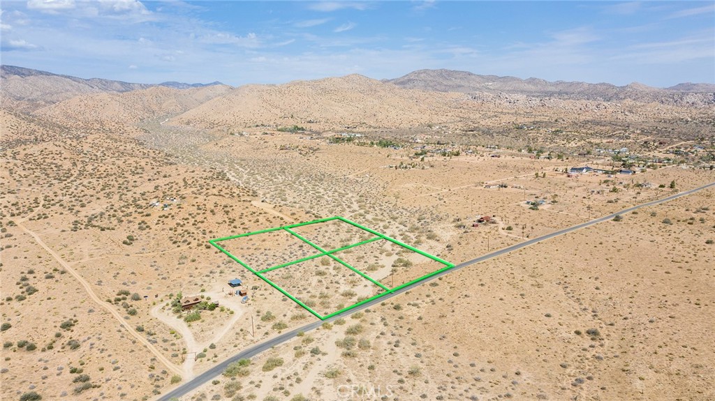 Amazing opportunity to develop your own Rimrock getaway, near Pioneertown and Big Bear Mountain. Includes four 1.24 acre parcels. Each lot can be developed independently (buyer to check) making it an ideal group investment with friends looking to build a retreat. Or dissolve the lot lines and create one large 4.96 acre parcel on which to build larger home with plenty of room to spare for privacy or pets. Paved Rimrock Road frontage. Wilderness hiking from property. Burns Canyon Rd – which turns into Forest Service Rd 2N02 – takes you deep into the rural mountains, minutes from this property. Drive in the opposite direction a short distance and catch a show at Pappy and Harriet’s, where the likes of Paul McCartney and many others have played. Whether you’re looking for rural solitude or socializing with others around drink and dinner in Pioneertown, the opportunity awaits for all your desert dreams. Motivated Seller.