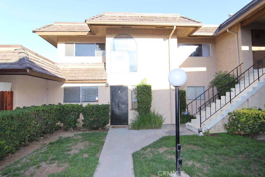 LOCATION, LOCATION, LOCATION! Very nice townhouse with upgrades throughout. New Laminate flooring, upgrades kitchen appliances and cabinets. New Painting. 2 bedrooms & 1.5 baths. Immaculate! Patio with storage area. Laundry room in the unit. One car garage in bldg plus one additional. Community pool, spa and clubhouse. Low cost HOA that includes water and trash. A delightful home in very nice, quiet desirable complex with walkways & green landscaping! The closest grocery store are Sprouts Farmers Market, Smart & Final extra! And Walmart Supercenter. Nearby Regal Cinema, Coffee shops include Boston Donuts, Panera Bread and Corner Bakery Cafe...