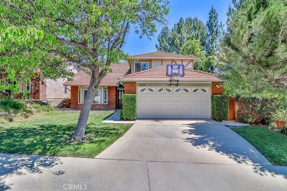 Spacious home with updated kitchen and pool in desirable Agoura Hills! Kitchen with tons of storage and granite countertops opens to family room with fireplace and overlooks pool. One-room suite on ground floor with only one step and bathroom with tub and shower across the hall. Enormous master suite has fireplace, balcony with new sliding doors to come, walk-in closet and huge bathroom with double sinks, separate shower and roomy soaking tub. Award-winning Las Virgenes schools. Come try out the good life in Agoura Hills!