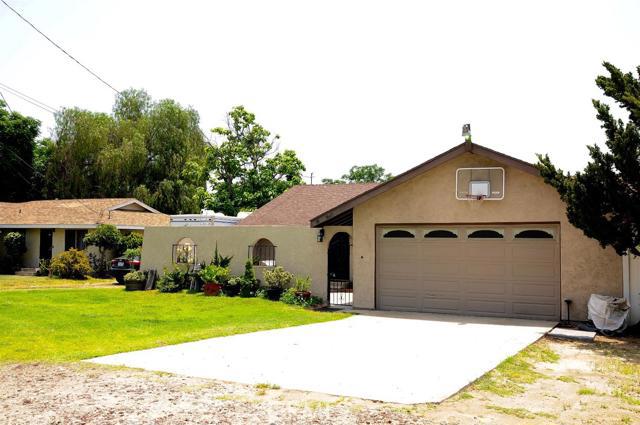 REDUCED! Looking for a PERFECT home close to the Freeway, Entertainment, Parks and more? Look no further! Come take a look at this beautifully remodeled home offering over 2,048sqft of living space, large bonus room with wood burning stove, backyard access, recessed lighting, granite counters, black appliances, newer dual pane windows throughout, gated RV access & 110 hook ups on the newly updated/reconfigured electrical panel, unto 8 parking spots to offer guest, etc. This property allows you to have horses, chickens, etc. You are just in time to enjoy your fully enclosed and secure courtyard just perfect for summer. You don't want to miss this incredible home. Schedule your showing now! Association Amenities: None # of RV Spaces: 0NONE Lot Location Type: Standard Location Landscaping: Sprinklers Special Features: None # of Attached Spaces: 2 # of Detached Spaces: 0