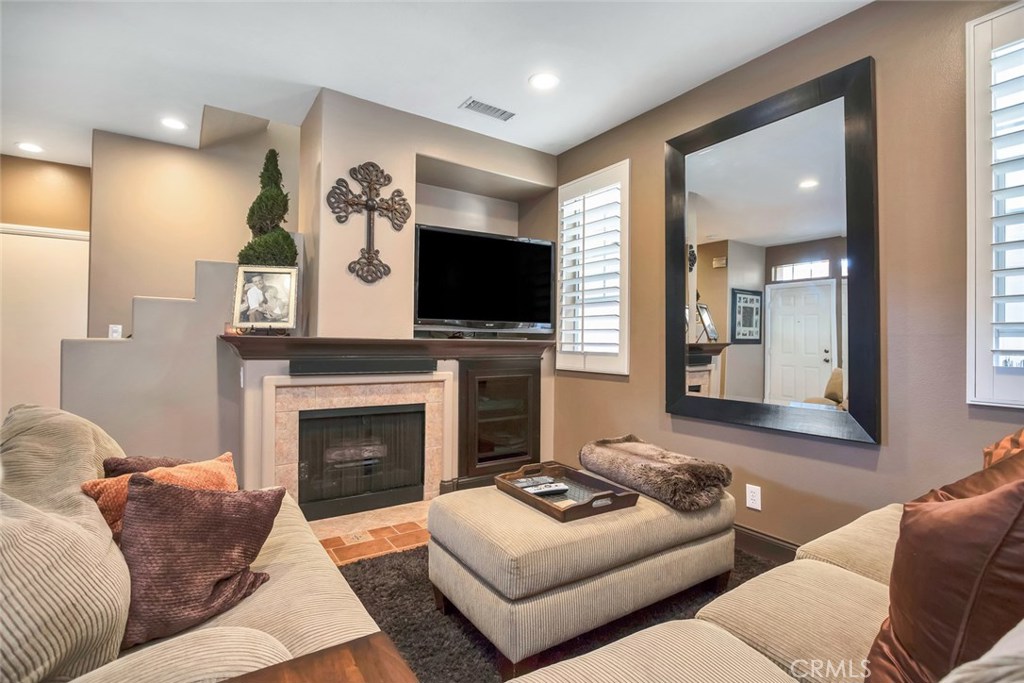 Just Fell Out -Appraisal at $629900 on 11/1/2016 FHA approved ! 80k in recent UPGRADES! Beautiful TURNKEY! Recent Seller renovation to every custom touch. Just minutes to beach. Unexpected move plan creates a unique opportunity to own this AMZING home. Low HOA in exclusive gated Aliso community. Breathtaking Kitchen , custom paint, Recessed lighting, premium private lot with green belt view, custom flooring, tile wood and upgraded carpet in master. Stainless appliances, all new cabinets in kitchen with granite countertops. Wine bar, wine cooler, custom cabinets throughout house with built in desk (w\ granite counter top) in 3rd bedroom currently used as an office, includes murphy bed with closet\storage. Plantation shutters, new windows, French doors to patio, frameless glass shower enclosures. Private yard has entertaining space and and fenced for kids and pets . this One will not Last!