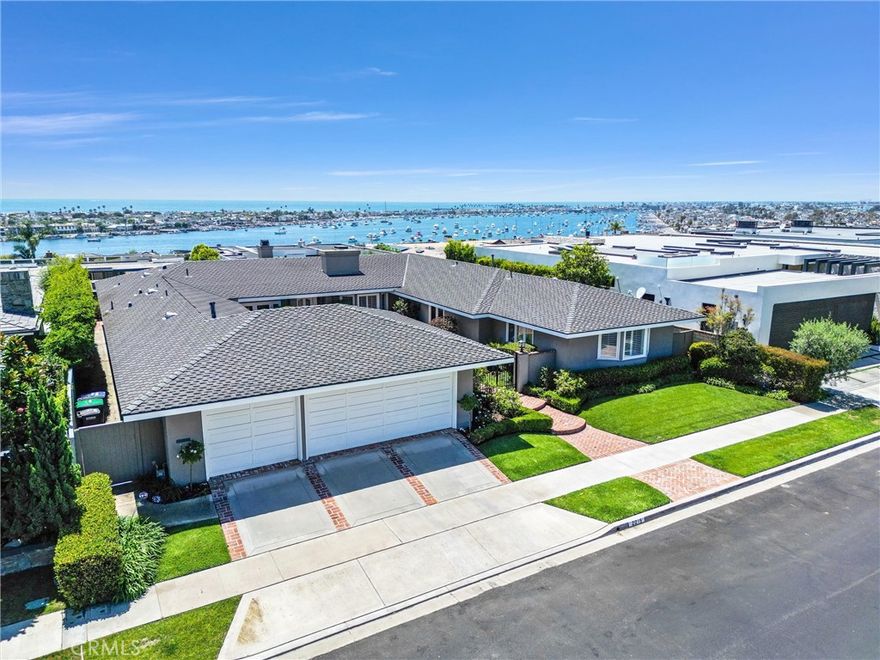 Welcome to one of the most expansive ocean view homes in Irvine Terrace. This timeless, beach-chic home located at 2015 Tahuna Terrace exudes classic elegance and is meticulously maintained both inside and out. Featuring new appliances and an energy-efficient AC and heat system, the property ensures modern comfort and sustainability.  The highlight of this exquisite home is the breathtaking ocean and harbor views, considered the best on the street, providing a serene backdrop to everyday living. Within walking distance to the picturesque Balboa Island and the upscale shopping and dining experiences of Fashion Island, this home offers convenience and luxury. Located in a family-friendly neighborhood with top-rated schools, this residence is perfect for those seeking a vibrant community atmosphere combined with accessibility to some of the best amenities the area has to offer. Don’t miss the chance to own a piece of coastal paradise at 2015 Tahuna Terrace.