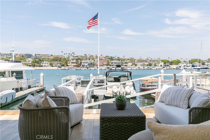 704 Via Lido Nord boasts an exceptional bayfront setting at Lido Isle's coveted eastern edge. Beautifully remodeled, this property offers spectacular 180-degree views of Newport Harbor, with 35 feet of prime bay frontage along the main channel, providing a dynamic panorama of waterfront activity, city lights, and distant mountains. Upon entering this stunning residence, you are immediately struck by its breathtaking views and prime location, presented in a relaxed yet refined coastal contemporary style. The expansive lot features inviting outdoor spaces and a dock accommodating two vessels, ideal for year-round entertaining and enjoying the ever-changing vistas over the renowned Nord channel. The home includes four bedrooms and four and a half bathrooms, including a suite/office on the first level. Spanning nearly 3,200 square feet, the living areas are sophisticated yet comfortable, highlighted by an open floor plan. The property is equipped with an elevator, a gourmet kitchen with top-of-the-line appliances, hardwood floors, elegant stone finishes, designer touches, custom electric shades, high ceilings, and meticulous craftsmanship. The open-concept living room, kitchen, and dining area are perfect for family gatherings, enhanced by floor-to-ceiling glass sliders that open to a spacious patio with a BBQ area, a new waterfront deck, and a dock with seaside seating. The master suite serves as a luxurious retreat, featuring a large balcony with stunning bay views, a beautiful fireplace, a generous walk-in closet, and a spa-like bathroom. The three additional bedrooms each have their own en-suite bathrooms. The property is meticulously maintained and move-in ready. Located within walking distance of award-winning restaurants, shopping, and entertainment, the residence offers a prime Newport Beach lifestyle in a highly desirable island neighborhood. Additionally, the Lido Isle private beach, clubhouse, and grassy park are just a short stroll down the block.