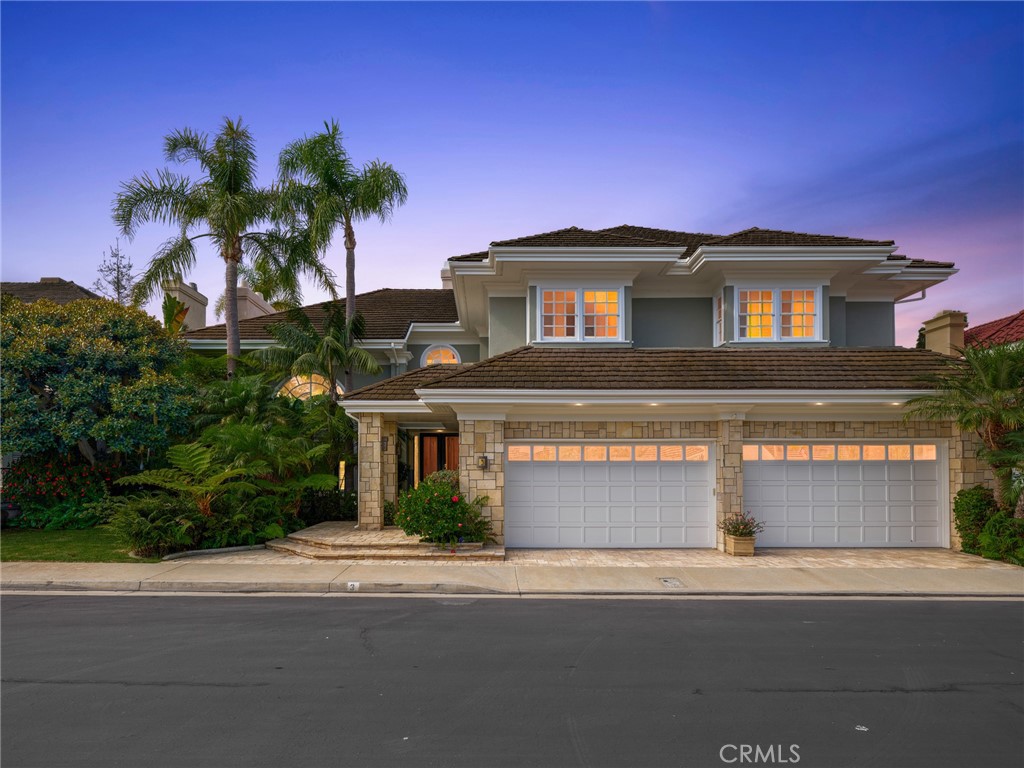Welcome to 3 Weybridge, an exquisite custom estate nestled in the prestigious guard-gated community of Belcourt, located in the heart of Newport Beach. This grand residence spans approximately 6,500 square feet of luxurious living space, offering a sophisticated and versatile floor plan perfect for elegant living and entertaining. Upon entry, the impressive formal foyer welcomes you with its dramatic curved staircase and soaring vaulted ceilings, immediately setting the tone for the home's palatial scale. The expansive formal living room, anchored by a breathtaking floor-to-ceiling fireplace, provides a warm and inviting space for gatherings. The formal dining room is the perfect respite for entertaining guests and family in style. Adjacent, the gourmet kitchen, a chef's dream complete with stainless steel appliances, an oversized island, wet bar and breakfast nook, opens gracefully to the spacious family room, creating a seamless flow for both casual, everyday living and formal entertaining. French doors abound, leading to a resort-style backyard, an entertainer’s paradise complete with a sparkling pool, waterfall, and a freestanding cabana featuring its own fireplace, television and heaters. The outdoor kitchen is a culinary masterpiece, equipped with a smoker oven, barbecue, refrigerator, and bar seating—perfect for hosting lavish outdoor affairs. Each of the four oversized bedrooms is a private en-suite retreat, ensuring comfort and privacy. The master suite is a sanctuary unto itself, featuring a serene sitting area, a luxurious retreat, and a striking double-sided fireplace that also warms the expansive private office, which could easily serve as a fifth bedroom. An enclosed lanai also provides a versatile space ideal for a nursery, library, or an additional office. Truly setting this home apart from the rest is the unparalleled basement level, which is offers endless options for family entertainment. With a temperature-controlled wine room, a sauna, huge storage space and large family room, this would also be an ideal space for a gym or home theatre. This magnificent estate is completed by a spacious four-car garage, combining both elegance and practicality. Experience refined living at its finest in this exceptional Belcourt estate.