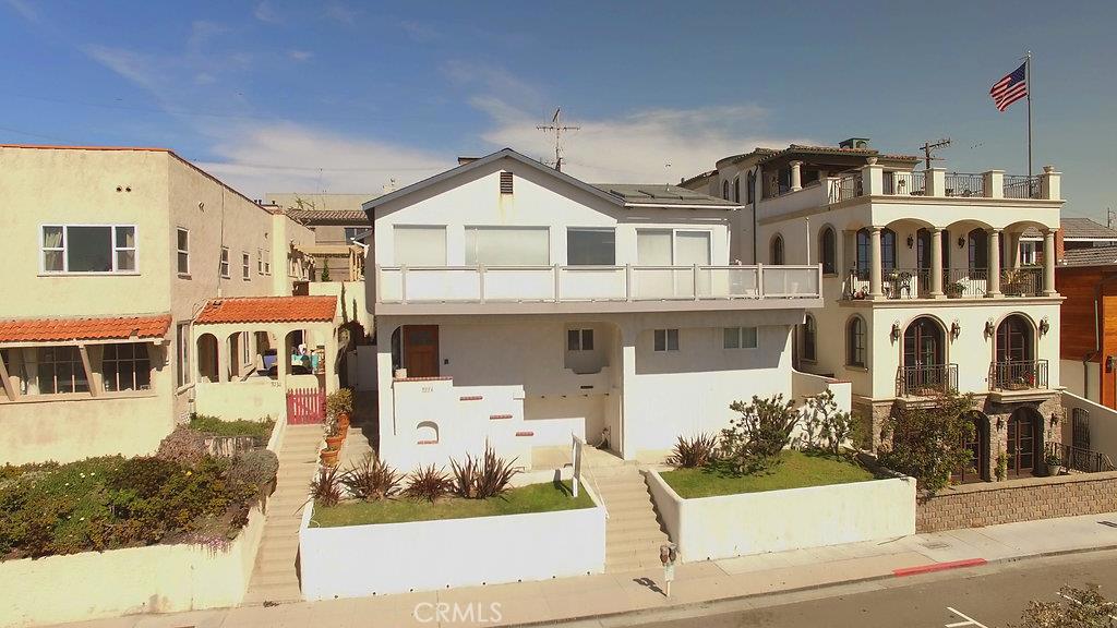 This trophy property is located in a bulls-eye location on Hermosa Ave, in between Longfellow Ave and 34th Street. It sits up high on an elevated 4247 sqft lot with 50 feet of prime Hermosa Ave frontage, offering the best ocean views in town. The current owners have fully permitted, shovel ready plans for a resort living 7300 sqft home (with 1800 sqft of whitewater view decks). The plans are presented by award winning architectural firm KAA with interiors by world renowned designer Tim Clarke. The main living space with chef's kitchen, living and dining rooms and two decks is on the top floor. The next level is dedicated to the master bedroom suite complete with his and hers: offices; walk-in closets and; bathrooms. The bedroom level has four expansive en suite bedrooms. The bottom level boasts a pool, yoga studio, kids entertainment room, guest suite and wine hall. The lot has a convex approval from the city allowing the home to sit higher on the lot, allowing a superior floor plan and all four levels are above grade with THREE floors of ocean views. The property is East/West oriented, so the flow of your home can be fully focused right where it should be: on the sparkling Pacific Ocean.