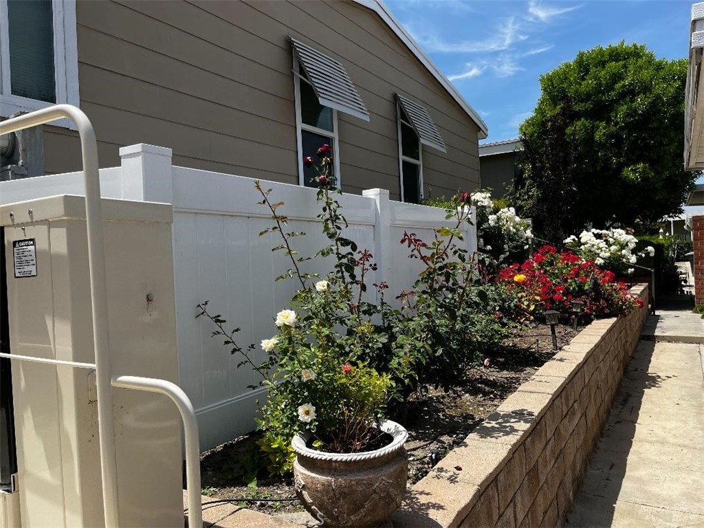 LAKE VIEW!!! LAKE VIEW!!! Welcome to beautiful Lake Los Serranos Mobile Home Park for the 55+ Community. This popular neighborhood has two clubhouses, a pool and spa, a sauna and exercise classes. This coveted lake front spot has a beautifully upgraded mobile home with 2 bedrooms and 2 baths and newer windows. The large master bedroom has a huge master closet and the master bath has a large tub with a separate shower. Sit in your living or dining room and enjoy gorgeous views of the lake or sit on your deck. This home boasts an efficient kitchen with stainless steel appliances, white cabinets and black counter tops and built in dinette area. The large family room is perfect for entertaining or just relaxing. The den is a perfect reading spot or for use as an in home office. The indoor laundry also an exterior door that leads to a ramp and wheelchair lift. The 2 car, covered carport also has a large storage shed. Grab this one while it's still available.