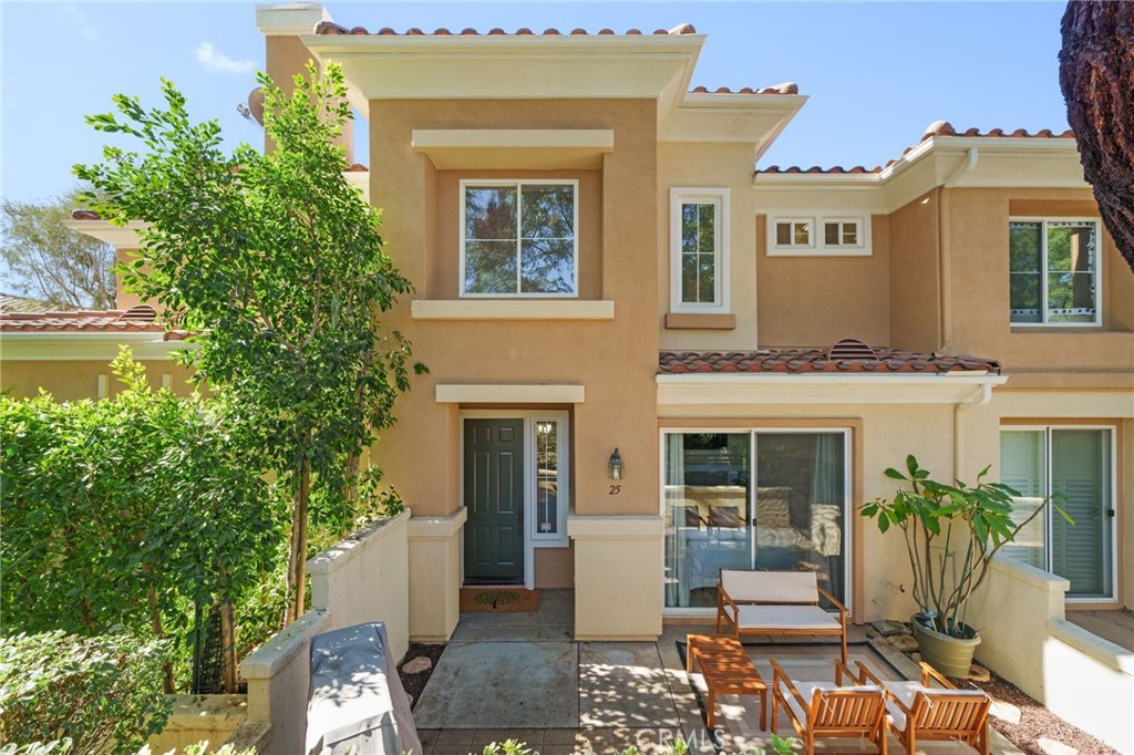 Welcome Home! This turnkey condo offering 2 bedrooms and 2.5 bathrooms is located in the highly desirable Terracina Community. Upon entry you are greeted by upgraded laminate flooring installed throughout the main living areas providing a uniform flow and easy maintenance. The family room is flanked with a fireplace creating a cozy environment and opens up to the kitchen boasting stainless steel appliances and plenty of custom cabinets for all of your storage needs. The laundry room is located on the first floor. Moving along upstairs you will find the master suite and junior master suite, both equipped with walk-in closets and private bathrooms. The patio area provides the perfect space to enjoy your morning coffee and California sunshine. Attached 2 car garage for added convenience. The Terracina homes are ideally located within walking distance to beautiful RSM Lake, Central Park where the summer concerts and other community events take place, array of restaurant options ranging from high end to fast food, luxury movie theatre, variety of shopping, library, and neighborhood parks. The SAMLARC amenities includes the beach club lagoon at RSM lake which has a beach volleyball, water toy rentals, hiking trails, 4 Junior Olympic sized pools, 12 parks, and much more! LOW HOA, NO MELLO-ROOS, FHA AND VA APPROVED!! You do not want to miss the opportunity.