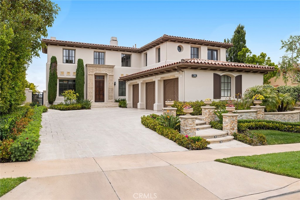 Immerse yourself in unparalleled coastal luxury at this exquisite Montecito Plan 2 residence nestled within the prestigious guard-gated Pelican Heights community. Dazzling ocean and harbor vistas mesmerize by day, transitioning to a captivating tapestry of city lights at night. Spanning over 4,800 square feet of luxuriously appointed living space, this open-concept masterpiece seamlessly blends the elegance of a dramatic vaulted foyer and soaring 10-foot ceilings with the functionality of a gourmet kitchen, inviting family room, and entertainer's dream backyard. Unwind in five exquisite ensuite bedrooms thoughtfully designed for ultimate comfort and privacy. The main floor guest retreat offers a serene haven, while the upper level boasts four additional suites, culminating in the master suite – a sanctuary of luxury featuring an oversized retreat and breathtaking panoramic ocean views. This property was tastefully renovated and embodies the essence of refined living. Imagine hosting unforgettable gatherings in the expansive backyard, complete with a sparkling pool and a paver system designed for seamless indoor-outdoor entertainment. Beyond the walls of your private oasis lies a world of unparalleled leisure. Pelican Hill Resort with its championship golf courses beckons, while the pristine shores of Crystal Cove and Orange County's premier shopping destinations are just moments away. Award-winning schools and resort-style beaches complete this idyllic setting, making it the perfect haven for discerning residents.
