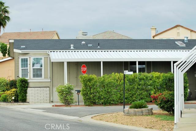 Exceptionally clean and well maintained manufactured home with hardscape surround and covered driveway. Also a huge storage shed and patio area.
This lives like a single family home with approximately 1600 sq. ft. of living space. You will love this large 3 BR 2BA home with its inviting entrance and high ceilings bathed with natural light. The grand master suite has ample closet space and lovely bathroom with tub and a separate shower. The kitchen is made for entertaining with its large breakfast bar, plenty of cabinet and counter space and opens to the Dining and Family room. The other 2 bedroom and full bathroom are situated on the other side of home. Community has RV parking area in back corner.
Hurry as this is a must see! Low land space rent only $875 per month