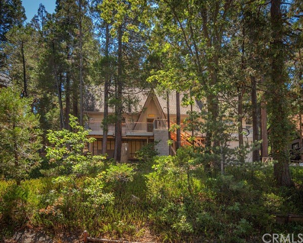 Huge Price Reduction! A great family spread or part time retreat. 4 Bedrooms, 2 Baths, two living spaces, treed front and rear decks, lush lot, walking distance to Lake Arrowhead's favorite North Bay! Seller has made updates throughout, including flooring, kitchen, bathrooms, counter tops, cabinets, paint, and plenty of other odds and ends. Property has an open floor plan, single car garage and plenty of parking. Make an offer for this as is opportunity today! Motivated seller!