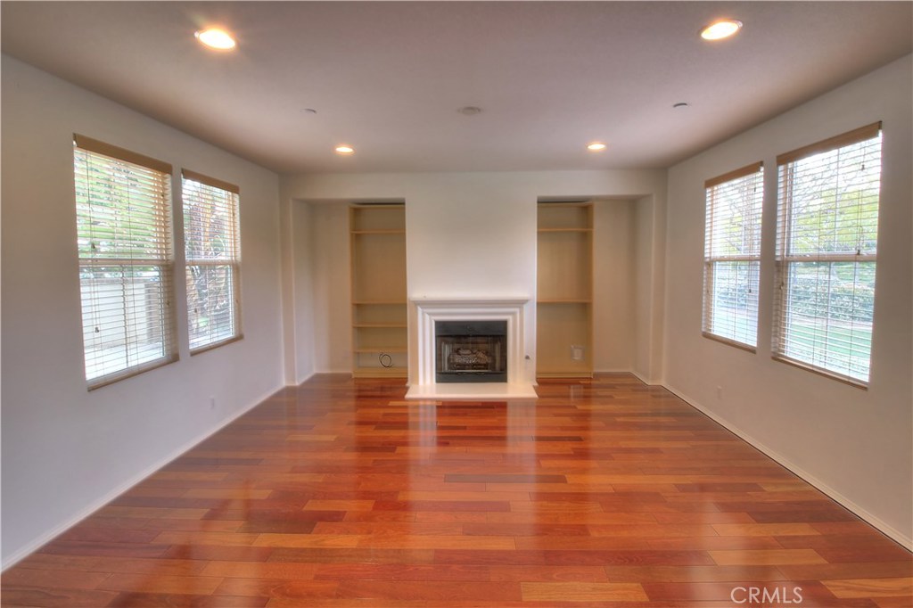 Columbus Grove townhome with single family feel! This end unit, 3 bed plus den, Clarendon home has a central location and numerous upgrades. This townhome features hardwood floors, stainless steel appliances, and upgraded cabinetry. The Columbus Grove pool and clubhouse is just minutes away from this beautiful unit. The entry leads you into the living area with stone fireplace. The first floor also features a den that's perfect for the home office, playroom or recreation space. The dining room is off of the well appointed kitchen complete with an island that creates a great open space. The upstairs is highlighted by a large master bedroom with room for a reading area or office station. Master bath has a separate shower and soaker tub and also features a dual vanity leading to the large walk-in closet. Upstairs full bath has dual vanity and separate sink and shower area. One of the homes unique features is a full driveway leading to the attached 2-car garage.