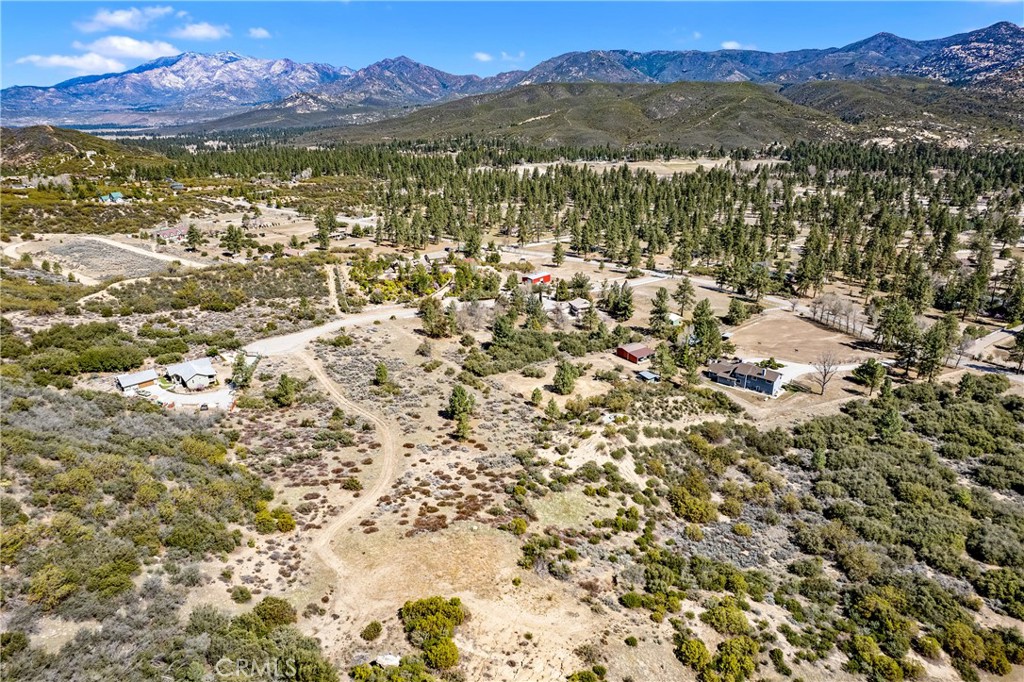 **Build Your Dream VIEW Home & Ranch in Garner Valley!**
**A Rare Opportunity - Land with a VIEW**
Welcome to Garner Valley—an exclusive neighborhood that few have had the privilege to discover. This expansive 37-acre lot offers everything you could dream of for your ranch lifestyle, with roughly 16 usable acres providing ample space for all your vision and ambitions.
Whether you're looking to build a custom home, a guest house, a barn, an arena, a round pen, or a workshop, this property has it all. For those with equestrian aspirations, this lot is perfect! You can have up to 12 horses per every 5 acres, making it ideal for horse breeding or any other equestrian ventures you might have in mind.
Situated at the end of a peaceful cul-de-sac, this property features a long driveway that leads you up to the building pad. From here, you’ll enjoy 180-degree panoramic views of the mountains, offering some of the best vistas in the entire valley. The serene beauty and quiet of the area provide the perfect escape from the hustle and bustle of city life.
This neighborhood features a wonderful clubhouse perfect for hosting special events or social gatherings. Residents also enjoy access to a community horse arena, a round pen, and scenic picnic areas—ideal for outdoor activities with friends, family, or fellow neighbors.
While the property offers privacy and peace, it’s conveniently located to major areas:
- 35 minutes to Palm Desert
- 50 minutes to Temecula
- 45 minutes to Hemet
- 20 minutes to the charming town of Idyllwild with its cozy restaurants, coffee shops, and boutique shopping.
With 26 miles of private hiking and horseback riding trails, this property is a true nature lover's paradise. From horseback riding to hiking, outdoor adventures are at your doorstep.
This rare opportunity to own over 37 acres in one of California's most serene and picturesque locations offers the perfect balance of privacy, nature, and close access to the city. Come create the home and lifestyle you've always dreamed about!