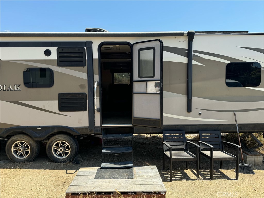 Gentle rolling 18.80 acres at 35500 Benton Road, has 3 APN's 569-380-011, 569-380-012, 569-380-013, Parcel has a travel trailer that seller will leave with property as part of the sale price, as well as large toy hauler as part of the sales price, also has a few cargo containers for storage, and some out buildings, parcel is also loaded with oak trees, has electric & meter, has a well that seller has report showing 10 GPM. Truly amazing parcel only 1.7 miles from paved Red Mountain Road. Incredible views from the parcel, and lots of room for horses. Parcel is in-between Temecula & Hemet, close to Temecula Valley Wineries & Vineyards, close to Diamond Valley Lake, Lake Skinner & Vail Lake, for adult entertainment your close to Pechanga Casino, Soboba Casino, Pala Casino.