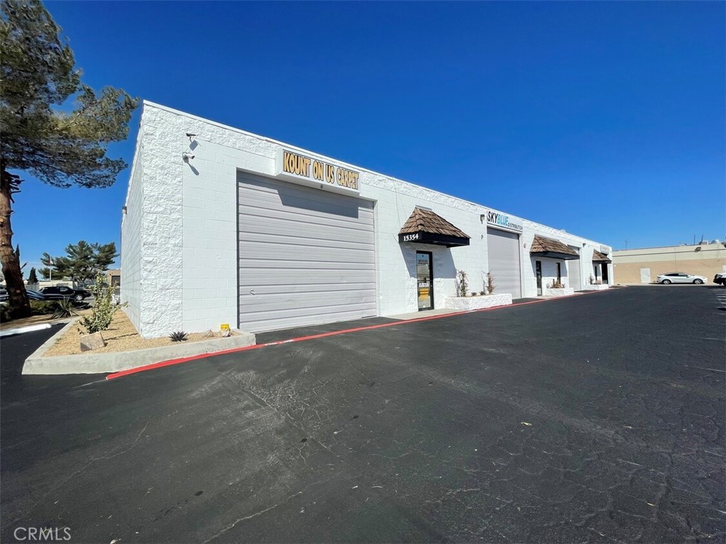 Conveniently situated off the 15 Freeway in the City of Victorville IPD zone, this 1,754-square-foot light industrial unit occupies the front of the building. Positioned on Anacapa Rd, it proudly displays tenant signage. The property boasts a recently revitalized exterior, showcasing new drought-tolerant landscaping and a fresh coat of paint, reflecting a strong sense of pride in ownership. Professionally managed, the facility accommodates a diverse group of well-established local and regional tenants, providing ample parking.