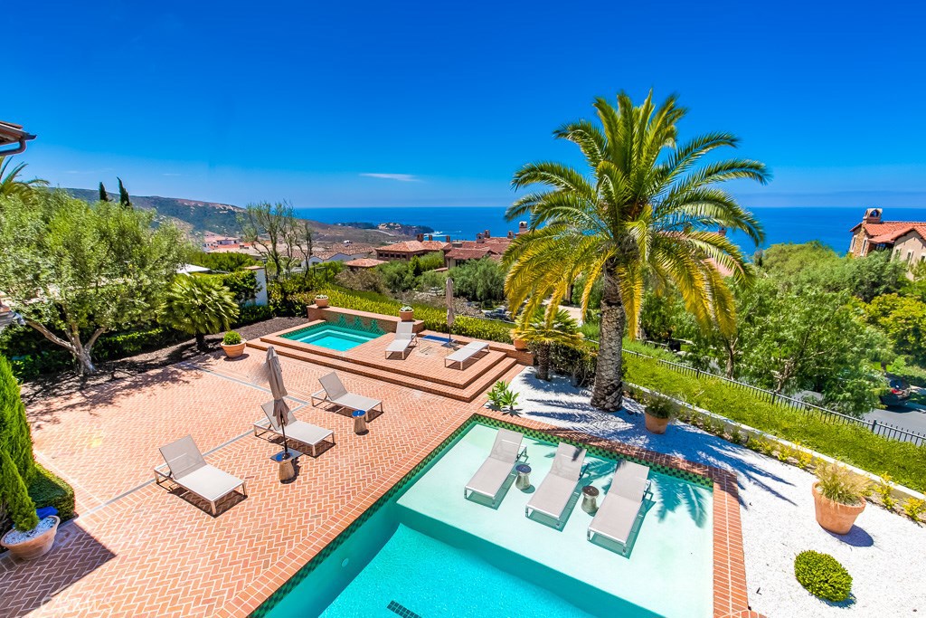 You won’t find a better value for a panoramic ocean view on a private corner location! Live your best life in this luxury Santa Barbara inspired estate with sweeping views of the Pacific Ocean & awe-inspiring sunsets. Nestled in the sought-after enclave of The Tides at Crystal Cove, a 24-hour guard gated community surrounded by natural beauty & pristine sandy beaches, this residence creates a sense of well-being exemplified by the finest in indoor-outdoor living. The kitchen creates an oasis of hospitality & showcases some of the finest materials & craftsmanship available including Statuario marble countertops – the most precious variety found in Italy, fully integrated Sub-Zero refrigerators & a Butler’s Pantry. The added appeal of a subterranean level with media room, wet bar, fitness room, & climate-controlled wine cellar that will become a social gathering destination. The 6-car garage is ideal for showcasing your automotive pursuits. The luxurious master suite will indulge your sensibilities with the wood beamed ceilings, private balcony, spa like bathroom, & walk-in closet that highlights style & functionality. Envision the myriad of outdoor spaces this estate has to offer including a spacious loggia, balconies, courtyards, ocean view decks & immaculate grounds with pool, spa & built-in BBQ, ideal for entertaining. Other highlights include white solid oak flooring flowing seamlessly throughout, Lutron lighting, elevator, private beach access, & award-winning schools.