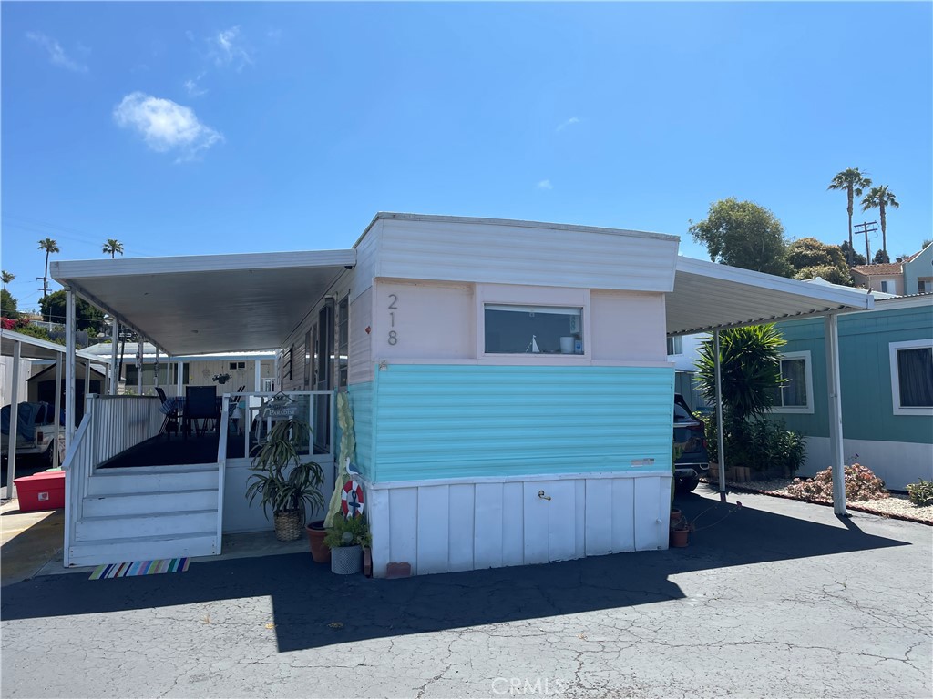 Introducing a rare fully furnished Midcentury Modern gem in La Salina Mobile Village, Oceanside! Stationed just minutes away from the sandy Buccaneer Beach, this beautifully maintained 2 bed, 1 bath mobile home offers an exceptional blend of beachside serenity and modern comfort. Step inside to discover a tastefully designed open floor plan, which includes a fully equipped kitchen with original wood cabinets and countertops. The living area, adorned with solid surface flooring, opens up to a spacious sun deck - perfect for soaking up the delightful ocean breezes. Additional features include a storage shed, a convenient location near public transport and shopping amenities and a host of community facilities: an on-site manager, a sparkling pool, a recreation room and clubhouse in the complex. Revel in coastal living exclusive to residents of this 55+ community.