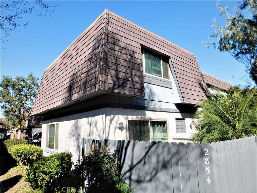 Come one come all...but only one can buy this ready to move in condominium. Seller is motivated with no contingencies. Two level unit with two bedrooms at the second level and an open floor plan at the first level. Kitchen has granite counter tops and living room has tiled flooring. Direct access to interior from the garage. There is an additional carport assigned right next to the unit.Living room has access to the patio for those private BBQ's. Association offers a pool, spa and a playground. To top it off this is an end unit so only one wall is shared...
