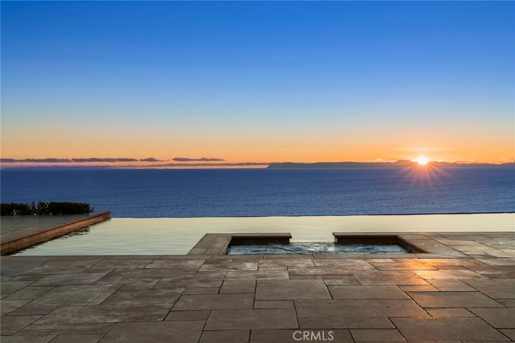 Considered by many as one of the most spectacular view properties in Crystal Cove, 40 Deep Sea’s stunning vistas of sea and sky are vast and unparalleled, including a water-to-water perspective over the sleek infinity-edge pool that includes ocean, Catalina Island, coastline, harbor landscape, city lights, Palos Verdes and stunning year-round sunsets. Spanning 4 spacious levels, the light and bright home was thoughtfully-designed to frame the gorgeous views, most notably through five sets of disappearing pocket doors and well-defined social spaces that flow seamlessly with the outdoors. Eminently livable, the floor plan offers 6 bedroom suites (one of which is currently used as an office), including a sumptuous master bedroom with dual bathrooms and closets, separate guest casita, wood-paneled library, and a gourmet kitchen with professional appliances. Noteworthy highlights include a 2-story indoor racquetball/basketball court, two bonus rooms, 12-person home theater with Italian leather chairs, 140" screen, HD projector, wine tasting room with 3,000-bottle climate-controlled wine cellar, gym with juice bar, built-in BBQ and an 8-car subterranean garage. Residents of Crystal Cove enjoy world-class amenities, including 24/7 guard-gated & patrolled security, tennis, swim, & close proximity to the Crystal Cove Promenade & Crystal Cove State Beach. NOTE: For those who prefer a more transitional style, a detailed design concept and contractor's estimate are available for review.