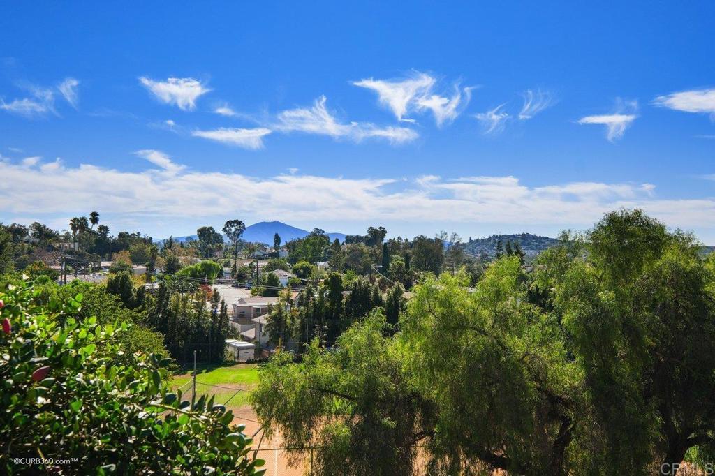 Enjoy Panoramic Views of Mountains and City lights from this absolutely GORGEOUS, Spacious, 1 bedroom. Enjoy the views while you are relaxing on your balcony listening to the birds sing or watching the stars at night. Light and bright unit with Views from living room with floor to ceiling dual paned windows & views from bedroom, kitchen & dining area. End unit with security door located on 2nd floor close to elevator. Unit has Remodeled kitchen and bathroom. Newly installed AC/Heat Pump, plush carpeting, baseboards and crown molding. Murphy bed in living room for guests. Steps away from Lake Murray/Mission Trails where you will enjoy hiking, biking, sailing, fishing, plus all the wildlife. Complex sits on 24acres of it's own land with garden ponds, water features, tennis courts with lights, pickle ball court, recreation room, exercise room with newer equipment plus shower and sauna facilities, 5 pools, 4spas, billiard room and car wash area. Resort style living close to shopping, restaurants, hiking trails, Cowles Mountain trails, downtown La Mesa and the La Mesa Farmers Market, Grossmont College & SDSU. Easy access to highways 8, 125 & 94.