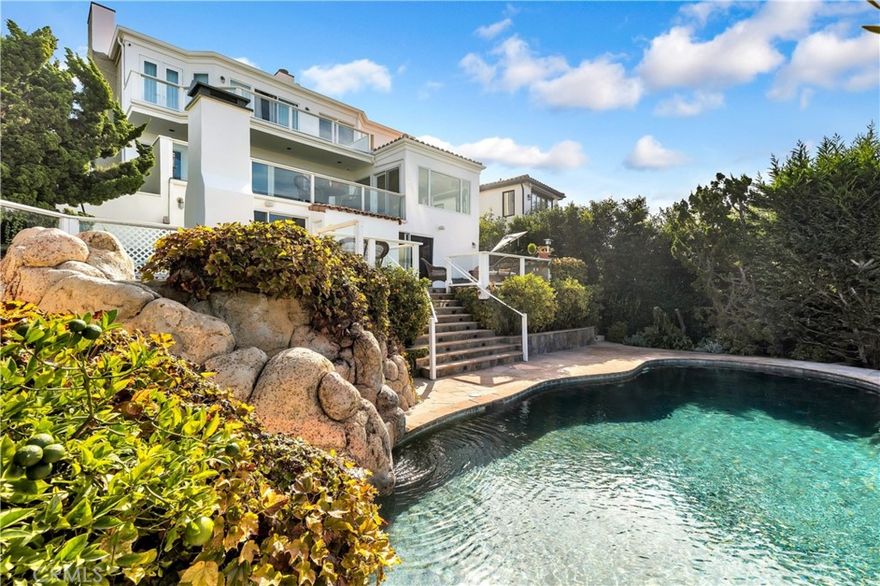 Inspired by the world-famed designer, Christian Liaigre, this four-bedroom, European Seaside estate has 

been extensively remodeled and expanded; utilizing organic lighting, refined materials, and 

incomparable views. The simple and pristine spaces, rich with sophisticated white rooms amongst java 

walnut wide plank flooring - include: a main floor office; living room with fireplace, elongated mantel, 

and essential built-ins; dining room surrounded by glass; a kitchen with stunning honed granite, loads of 

storage, appliance garages, two dishwashers, temperature-controlled wine fridge, 6 burner range with 

griddle, double oven, wide SubZero fridge, and a large breakfast bar. A downstairs bonus/pool room 

supplies a full bathroom with walk-in shower, secondary kitchen with direct access to the cooking 

terrace - replete with built-in BBQ, sink, viewing deck, outdoor fireplace, and spa with water feature -

trickling to the private inground pool within a sprawling rear yard overlooking the buck gully. Drenched 

in tranquil views, the master bedroom suite has a large viewing balcony, 2 walk-in closets, a dual-sided 

fireplace to the spa bathroom providing a soaking tub, separate vanities, & a marble enclosed walk-in 

shower with multiple heads & water views. The chorography of the lot creates spectacularly unique 

sunset vistas, dipping into the ocean and cascading through the trees. Live the CdM Lifestyle w/ direct

private beach access & proximity to exquisite dining & world-class shopping.