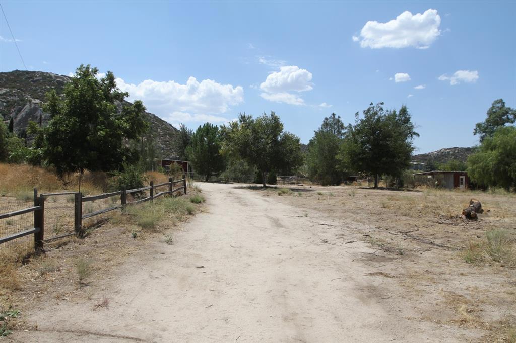 Nice 2 acre fully fenced lot with mature trees. Property has electric and well.Hay storage area with an insulated Feed Room with electricity, water, clothes washer hook up and a 3 sided horse stall.24' x 24' shop building, 2 corrals, 1 with a shelter. Play house with ATV storage underneath. Office / Utility Room with washer and electric dryer hookups. Pump house with booster pump for 3,000 gallon water storage tank 2 wells 1 new 560' well and 1 105' well both w/ new pumps .2001 Sundance travel trailer. Neighborhoods: Shockey Complex Features: ,, Other Fees: 0 Sewer: Perc Test Required