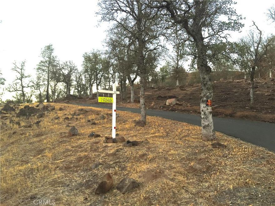 Beautiful 5.14 acres in the Hidden Valley Ranchos offering privacy in a wooded setting with plenty of usable space! Paved circular driveway with gated entry, fully fenced, along with a separate fenced garden area, and a seasonal creek that runs toward the back of property. The lot is in process of being cleared from Valley Fire, but what will remain is a gorgeous setting with a good well, a septic system and electricity already in place! Bring your house plans and create the estate property you have been dreaming about! Call today to schedule your showing!