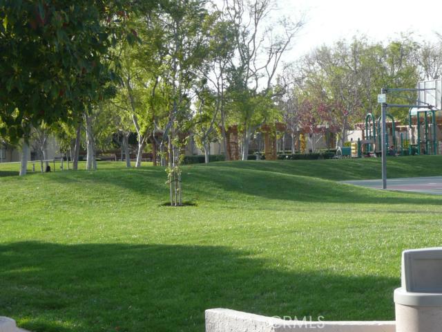 Very spacious one-bedroom, lower level end unit is adjacent to Columbia Square Park. The living room has a fireplace and tranquil green space view. The dining area has a sliding door to private patio. There is inside laundry area with washer/dryer included. Bath has porcelain. Dedicated carport with two spaces and overhead storage cabinet. Quiet location with Association pool, spa, BBQ, sport courts just steps away. Walking distance to UC Irvine, University High and University Center with shopping, restaurants and theaters.