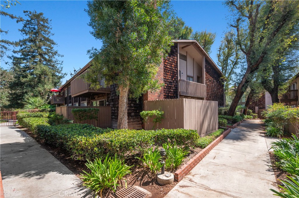 Welcome home! This fabulous ground floor corner unit has been remodeled and has an amazing location convenient to all community amenities - just steps away from the community pool & spa, sand volleyball court, BBQ area, clubhouse, gym, laundry room, offering a resort-like escape right at your doorstep. Renovated kitchen with granite countertops, popcorn ceilings removed, recessed lighting, new toilet, the sliding glass door leading to a large patio. The main bathroom has been renovated. Other features include a walk-in pantry, smart thermostat, keyless entry, and large storage unit behind car port. Great location convenient to parks, restaurants, grocery stores, and the freeway. This turnkey unit invites you to simply pack your bag and savor the delight of your new home. HOA includes water, gas and trash. And best part - your pets are allowed at The Redwoods! Got two cars? No problem! There's an assigned carport space with storage space and you can get a parking permit to park in an uncovered spaces for a second car. Low property tax and low HOA dues. Act now as this one will not last.