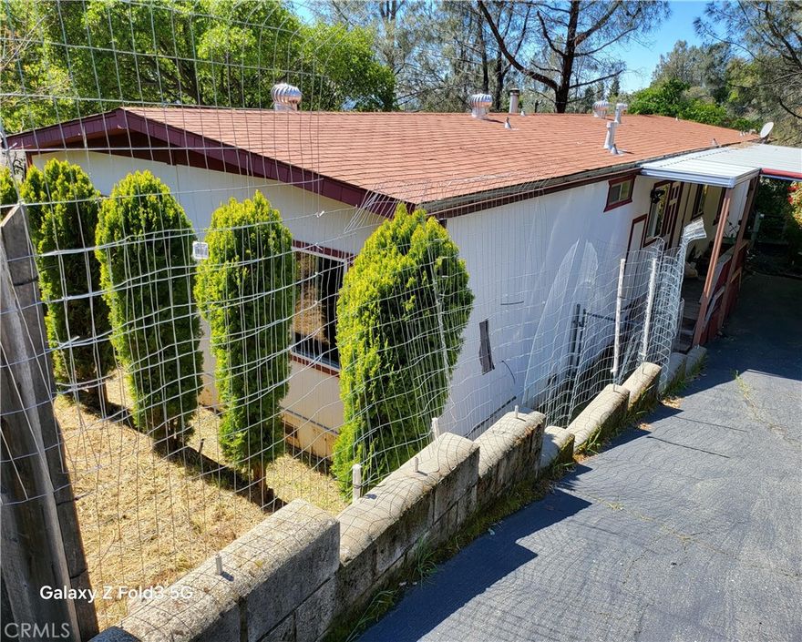 Nestled in a peaceful location, this 3-bedroom, 2-bathroom home offers comfort and convenience with a touch of tranquility. Boasting a spacious wrap-around deck with peek-a-boo views, you’ll love spending time outdoors, whether you're enjoying your morning coffee or entertaining friends.
Inside, the home features sleek laminate flooring throughout, creating a modern and low-maintenance feel. The gas cooktop in the kitchen will inspire your inner chef, while the separate laundry room with plenty of storage makes everyday tasks a breeze. With central heating and air, you'll stay comfortable year-round, no matter the season.
The property also includes a carport for convenient parking and a fenced-in yard for privacy and security that includes a nice wood storage building in the back yard—perfect for pets or a little gardening. Whether you’re relaxing on the deck or enjoying the cozy interior, this home is a true gem.
Don’t miss out on the opportunity to make this retreat your own!