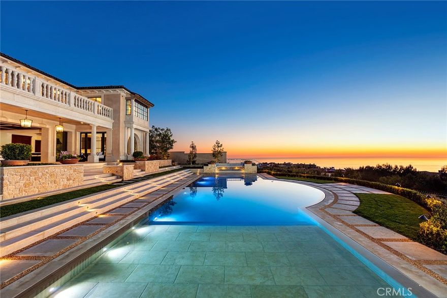 Newly completed in 2020, and situated on one of the finest ocean view lots in Crystal Cove, this Northern Italian-inspired custom built estate -- boasting the extraordinary design/build team of EBTA Architects, Pridemark Contractors & DeJager Design -- is now ready for immediate occupancy. At over 13,400 square feet of luxury interior living space, plus and additional 1,400 square feet of covered outdoor living space, the home offers six bedrooms and 11 baths, as well as the many additional rooms, spaces and amenities that one would expect in a property of this caliber. The main level is comprised of a two-story entry foyer, grand living/dining salon with a towering ceiling, and gourmet kitchen & morning room that open to a massive great room with panoramic views & adjacent lounge. A gracious guest suite, wood-paneled office/library, second kitchen and sizable butler’s pantry round out this floor. The upper level offers an expansive master suite with dual baths and closets, three additional bedroom suites, and a secondary laundry room. The expansive subterranean level includes a large entertainment area with bar and wine cellar, home theater, fitness room, nanny/housekeeping suite, large primary laundry room, and eight-car garage. Outside, the main loggia overlooks a beautiful pool, spa and cabana. Spectacular ocean, harbor, Catalina Island, city lights, sunsets and sweeping coastal vistas from San Clemente Island to Palos Verdes are featured throughout the residence.