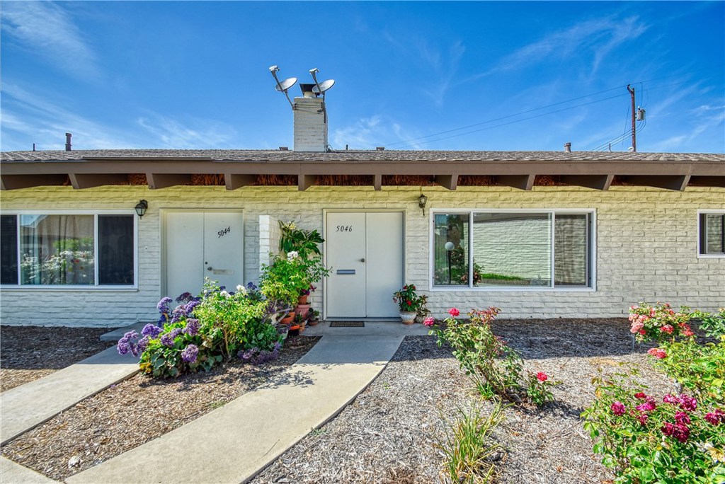 Stop Looking. Start Unpacking! This spacious Yorba Linda single level condo features 3 bedrooms, 2 bathrooms, inside laundry and a private patio. As you walk into the home you are greeted by vaulted ceilings, beautiful tile flooring, a fireplace and a large living room that is open to the dining area. The updated kitchen features ample cabinets, granite counters and stainless steel appliances. Off of the kitchen is access to the covered patio and one of the three bedrooms. The master suite has an updated bathroom with dual sinks and granite counters. Down the hall is another full bathroom that has also been updated with a walk-in shower with glass enclosure and granite counters. The third bedroom is at the end of the hall and features the same tile that is throughout the rest of the home. Some other upgrades include dual pane windows and ceiling fans. The ideal location is a short walk to the Yorba Linda Town Center that is home to Bristol Farms, The Blind Pig, Peet's Coffee and so much more. Sushi Noguchi, Blue Agave, Fitness Grill, Richard Nixon Library are also within walking distance. HOA pays for water, trash, sewer and exterior maintenance. FHA & VA approved!