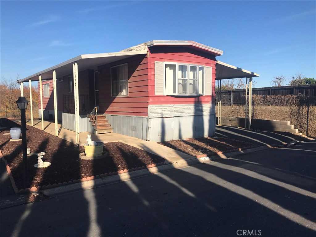 Bring your toolbelt! This mobile is cozy and has potential for the right person. Nestled at the back of a senior park, this mobile features a living area, eat in kitchen, gas stove, dishwasher, refrigerator and a large bedroom. Washer and dryer hook ups are located in an exterior shed off the covered patio.