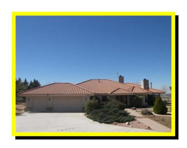 A HIDDEN TREASURE IN APPLE VALLEY!! CUSTOM BUILT HOME!! This ranch home sits on a hilltop in the Mariana Ranchos on 2.5 acres, completely fenced with a security gate. **Ready to subdivide, extra water meter already installed, parcel map can be assumed ** Existing home has a resort-like feel, is surrounded by beautiful mature pine trees and lush landscaping, with an unobstructed, breathtaking, panoramic view. Home has 3 spacious bedrooms with a bonus room, about 3100 sq ft of living space, 2 full baths, sunroom, master suite with jetted bath tub, stall shower, double sinks, & walk-in closet. Total of 3 fireplaces: 2 marble faced fireplaces, plus wood-burning stove in the exercise room. Large gourmet kitchen with double oven, center island stove, step-in pantry & built in refrigerator. It is set up for all kinds of animals, especially for horses. 36'X21' MD barn, 12'X12' Hay barn, & corrals. 40' X 12' X 14' carport for RV parking & hook ups. 20'X10' storage shed. Huge covered patio. Association Amenities: None # of RV Spaces: 0 Special Features: BA,BC,CC,,PTRY,TSNONE Frontage Type: Dirt Road Lot Location Type: On Equestrian Area Special Features: Garage Door Opener # of Attached Spaces: 3 # of Detached Spaces: 0