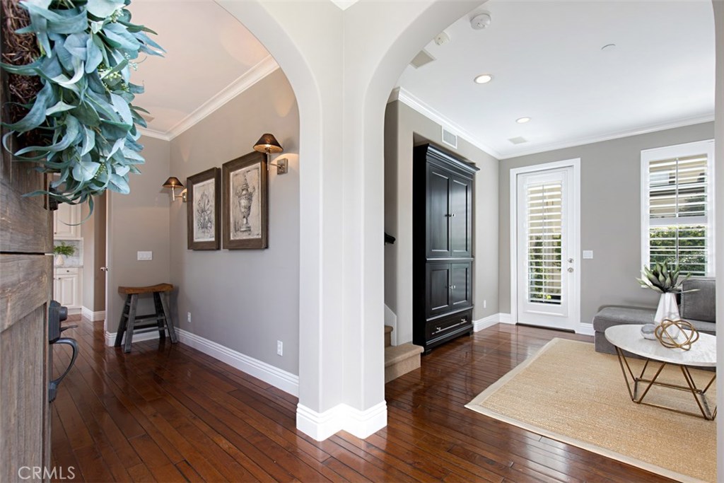 BACK ON THE MARKET! JUST REDUCED! MOTIVATED SELLER! Absolutely stunning Chantory Plan 3 located in the prestigeous gated Turtle Ridge Community. This detached condominium features two bedrooms, two and half bathrooms and a loft easily converted to a 3rd bedroom. This model perfect home has been elegantly upgraded with hardwood floors throughout main floor, custom media center in family room, crown molding, custom baseboards, surround sound, custom master closet built-in, and custom cabinets/media center in loft. A chef's delight, gourmet kitchen boasts Carrera marble countertops and high-end stainless steel appliances. Garage has custom storage cabinets, ceiling storage racks and epoxy flooring. Resort like costal community features amenities with club house kitchen, fireplace, cabanas, pools, spa, BBQ's, and hiking trails. This property is conveniently located near 73 fwy and just a few minutes’ drive to Fashion Island, John Wayne Airport and world renowned resorts and golf courses. Walking distance to award winning Vista Verde Elementary K-8 and nearby nationally ranked University High School.
