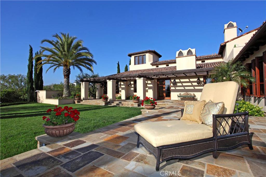 SELLERS MOTIVATED!! Experience the oasis at "Rancho de Oro", an approximate 12,796sf custom estate, located on a premier, elevated 3/4 acre lot, with 7 bedrooms, 8.5 baths, and over 30 rooms. Enjoy panoramic Shady Canyon Golf Course view, views of the renowned Clubhouse, romantic sunsets, city lights, Disneyland fireworks, and more. Views are enjoyed from every window and door and from the tower. Rancho de Oro is an entertainer's dream home with courtyard and wrap around garden, 4 levels of upscale appointments throughout, 2 executive offices, cozy library, Chef's gourmet kitchen, wine cellar, 2 custom oversized bars, 2 laundry rooms, pool powder/shower, east wing rooms, staff quarter, piano room with sound broadcast, private home theater with 8.2 surround sound, unique concert hall/sound studio/dance studio, and additional rooms for billiards, kid's games and poker. The estate was masterfully designed by acclaimed architect Rob Sinclair and builder Gary McLane. Award-winning landscape architect Mark Scott ensured that the opulent exterior grounds matched the lavish and heartfelt interior. 4-car garage includes a super charger for an electric car/Tesla, while the auto courtyard provides parking for an additional 6 cars.
